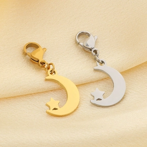 Detail of moon and star charms with lobster clasps in gold and silver stainless steel