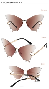 Detail view of gold-brown butterfly rimless sunglasses with woven texture metal temples