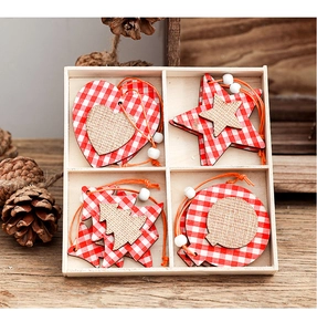 Close-up of wooden Christmas ornaments with red plaid and burlap in a divided storage box