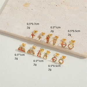 Selection of delicate gold star and geometric earrings with colorful zircon stones