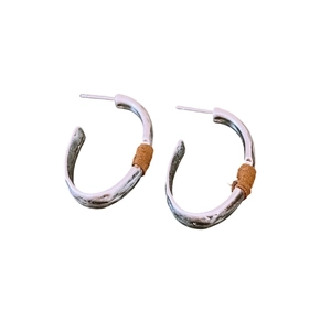 Chic silver matte C-shaped hoop earrings with brown suede wrap detailing