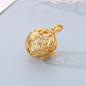 Detailed macro view of golden hollow spherical pendant with intricate geometric patterns