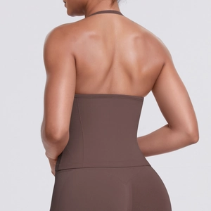 Detail of cross-back design on high-impact dark brown sports bra and leggings set