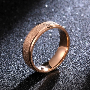 Rose gold matte brushed titanium steel 6mm ring with polished edges on dark background