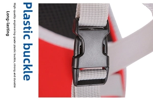Close-up of high-strength black plastic buckle and grey nylon webbing on pet carrier