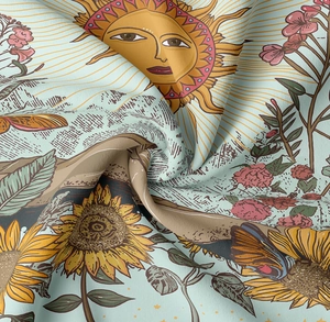 Dettaglio ravvicinato della trama in twill e della stampa vintage con sole e fiori