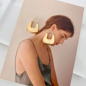 Large gold-colored hollow geometric earrings in polished stainless steel for women