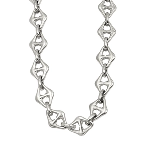 Macro shot of silver rhombic geometric chain links with polished metallic finish