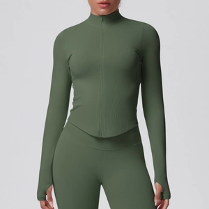 Detailed view of the dark green athletic jacket featuring thumbholes and ribbed texture