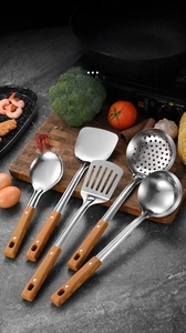 Detailed set of 5 stainless steel utensils with wood-grain handles on a kitchen board