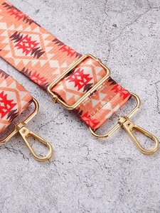 Adjustable ethnic pattern bag strap with orange geometric print and gold metal hooks