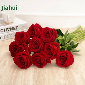 Detailed close-up of 10 red artificial roses with velvet petals and realistic green stems