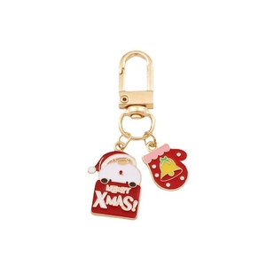 Cartoon Santa Claus metal keychain with golden hook, red bell, and Merry Xmas sign