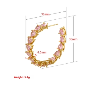 Detail view of 36mm 18K gold-plated C-shaped hoop earrings with pink heart zircon