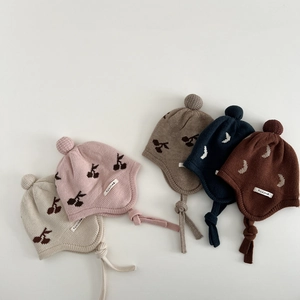 Knitted baby earflap hats with cherry and moon jacquard patterns in five various colors