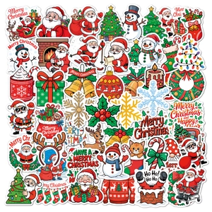 Flat lay of colorful Christmas vinyl stickers featuring Santa, reindeer, and holiday greetings