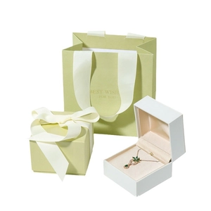 Luxury matcha green silk jewelry gift box and bag set with elegant ribbon bow design