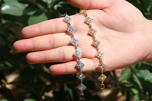 Elegant gold and silver geometric bangle set with sparkling cubic zirconia crystals