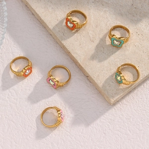 Set of six gold butterfly rings with colorful acrylic floral stones and ribbed bands