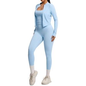 Three-piece light blue yoga set with zipper jacket, sports bra, and high-waisted leggings