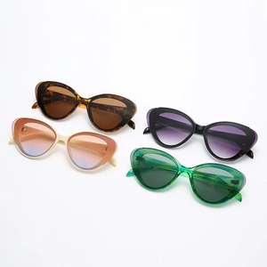 Chic cat eye sunglasses set in tortoise, white, black and green narrow retro frames