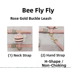 Detail of pink cat harness with bee design and rose gold adjustable metal buckles