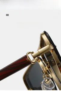 Macro detail of golden metal hinge with C-ring design and wood grain temples for sunglasses