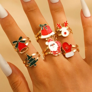 Detailed close-up of 5-piece adjustable Christmas rings with enamel elk and tree charms