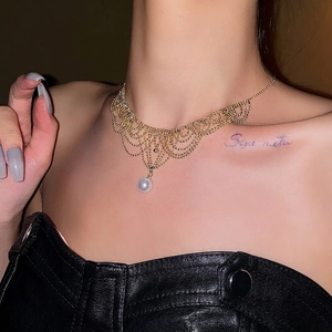 Elegant French vintage gold tassel lace necklace with pearl pendant on model