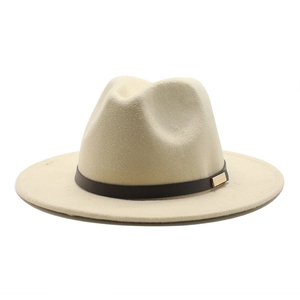 Detail of beige felt fedora hat featuring a brown decorative band and gold buckle