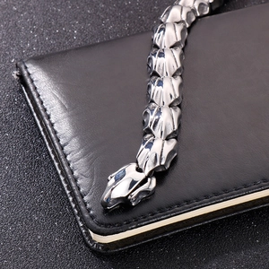 Silver punk style dragon bone titanium steel bracelet on black leather notebook