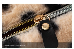 Macro detail of leopard print plush makeup bag with premium silver zipper and leather pull