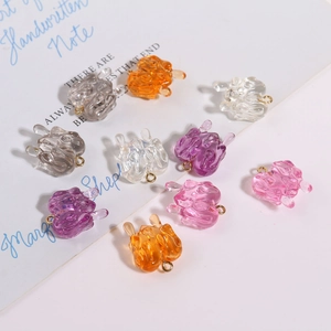 Macro detail of translucent resin bunny pendants with gold hooks for DIY jewelry making
