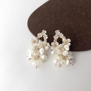 Elegant white jasmine flower drop earrings with rhinestones and gold-plated finish