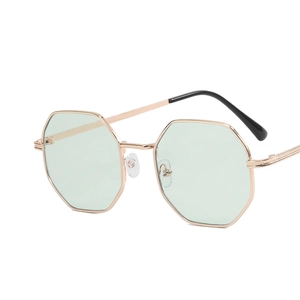 Octagonal polygon sunglasses with rose gold metal frames and light green tinted lenses