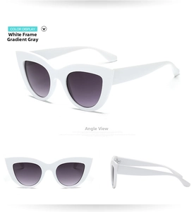 Detailed views of vintage cat eye sunglasses featuring white frames and gradient grey lenses