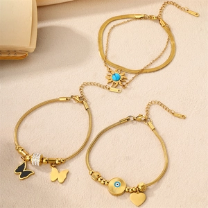 Gold 18K plated stainless steel bracelet set featuring butterfly and evil eye charms
