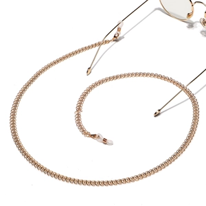 Elegant gold metal eyewear chain featuring hollow leaf shaped links and anti-slip silicone loops