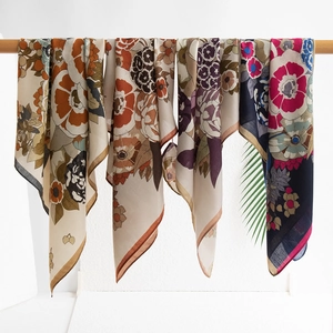 Retro geometric print faux silk square scarves hanging on a wooden hanger for women
