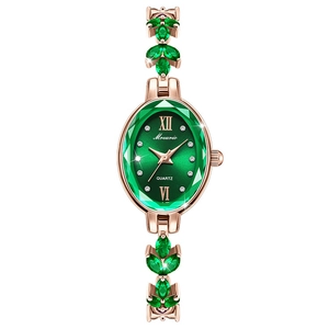 Elegant rose gold ladies quartz watch with green leaf crystals and faceted emerald dial