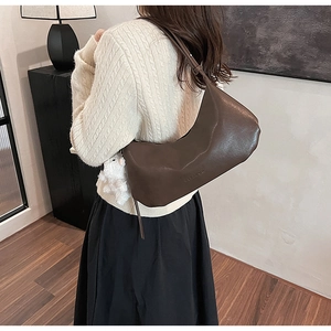 Deep brown PU leather crescent shoulder bag with cute white plush doll accessory