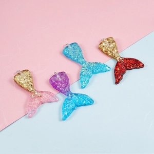 Resin mermaid tail charms with glitter gradient finish and metallic loops for DIY jewelry