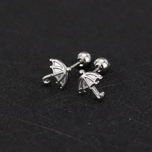 Detailed view of silver umbrella-shaped stud earrings with secure screw-on ball backings