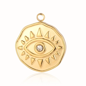 Macro detail of golden evil eye pendant with crystal inlay and polished metallic finish