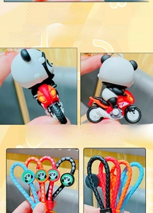 Detail of creative PVC panda motorcycle keychains with colorful braided wrist straps