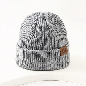 Winter grey ribbed knit beanie hat for kids with a brown leather W letter patch