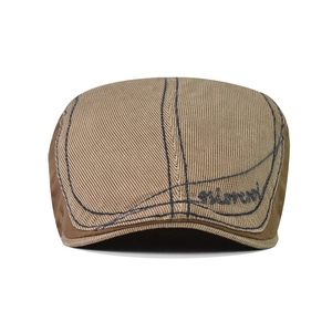Close-up of khaki cotton beret with Simonn embroidery and retro stitching detail