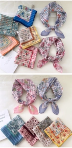 Flat lay of colorful floral cotton linen square scarves with vintage flower patterns