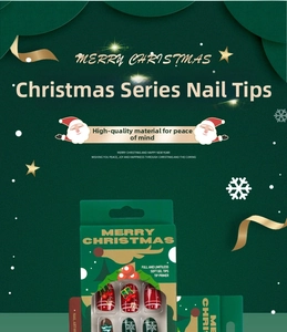 Detailed view of Christmas press-on nails with red and green bow and snowflake patterns