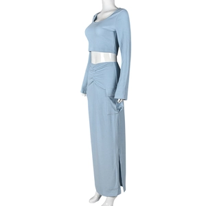 Detail view of light blue ribbed knit skirt featuring functional side pockets and side slit